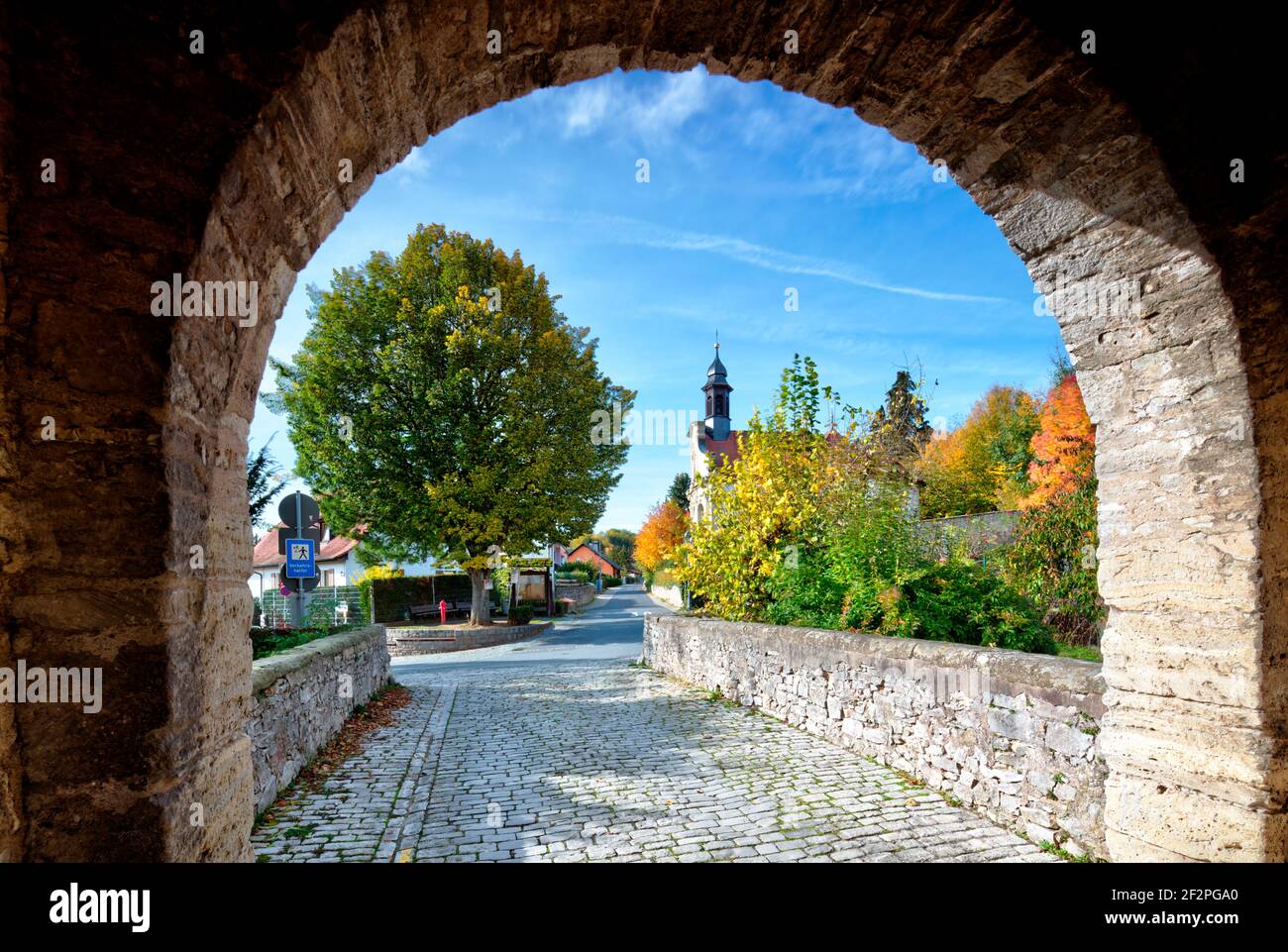 View from Erlacher Tor, Kreuzkapelle, house facade, autumn, historic town center, Sulzfeld am Main, Kitzingen district, Lower Franconia, Franconia, Bavaria, Germany Stock Photo
