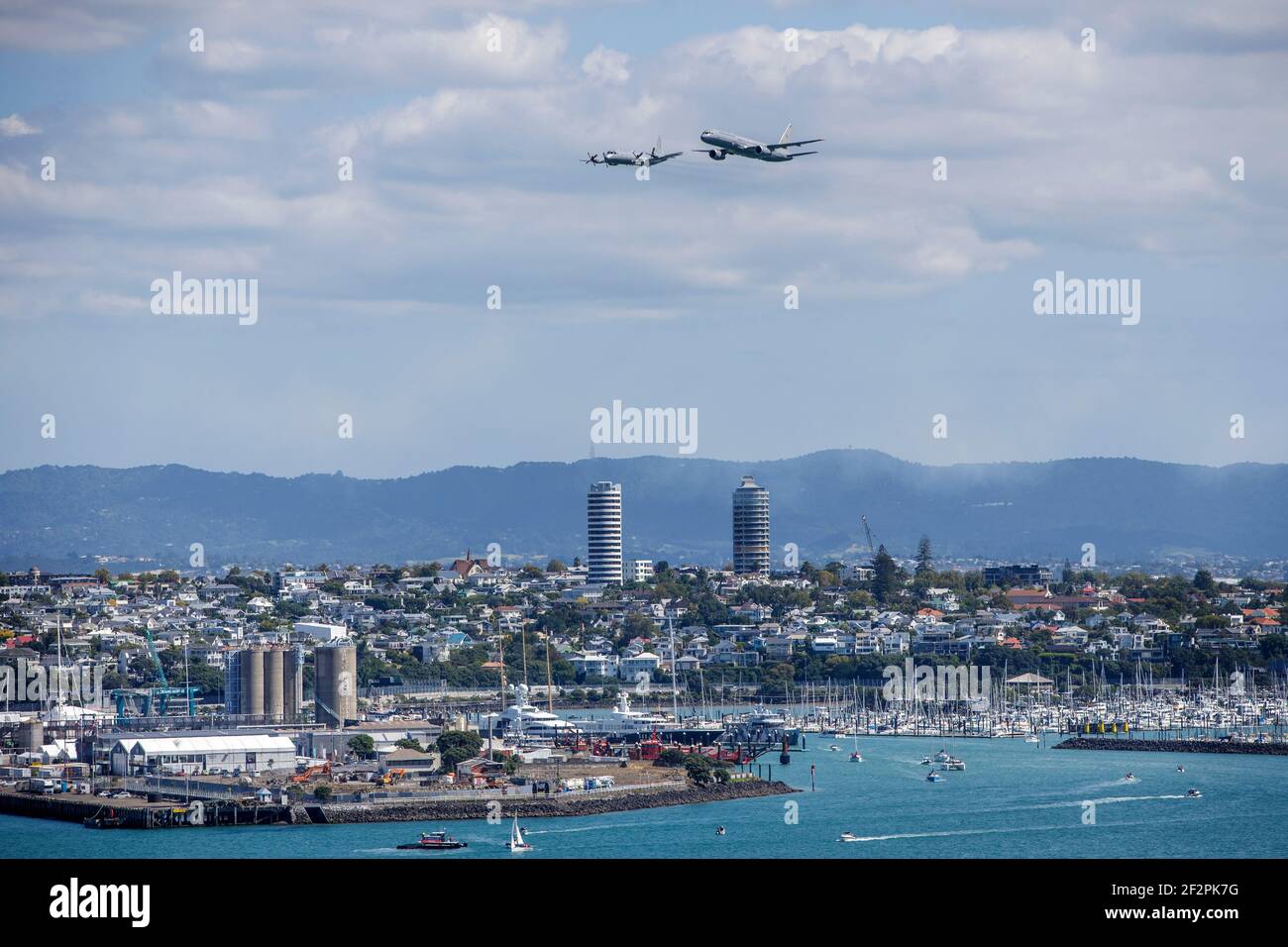 A flypast by a Boeing 757-2K2 and P-3K2 Orion of the Royal New Zealand Air Force over the America’s Cup Village in Auckland New Zealand Stock Photo