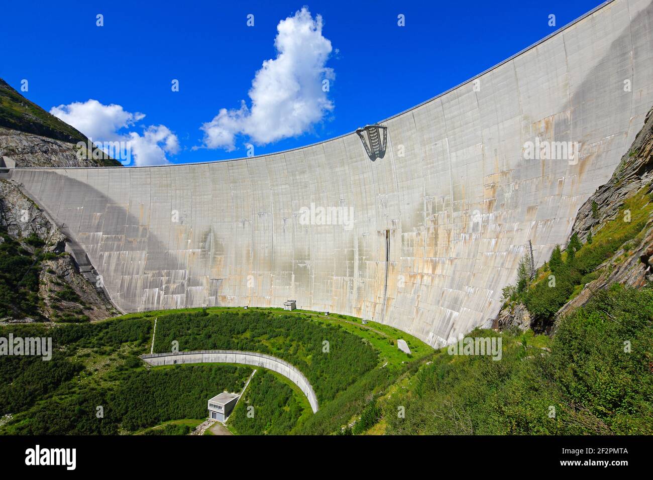 South view of the Kölnbrein dam against blue sky with clouds Stock ...