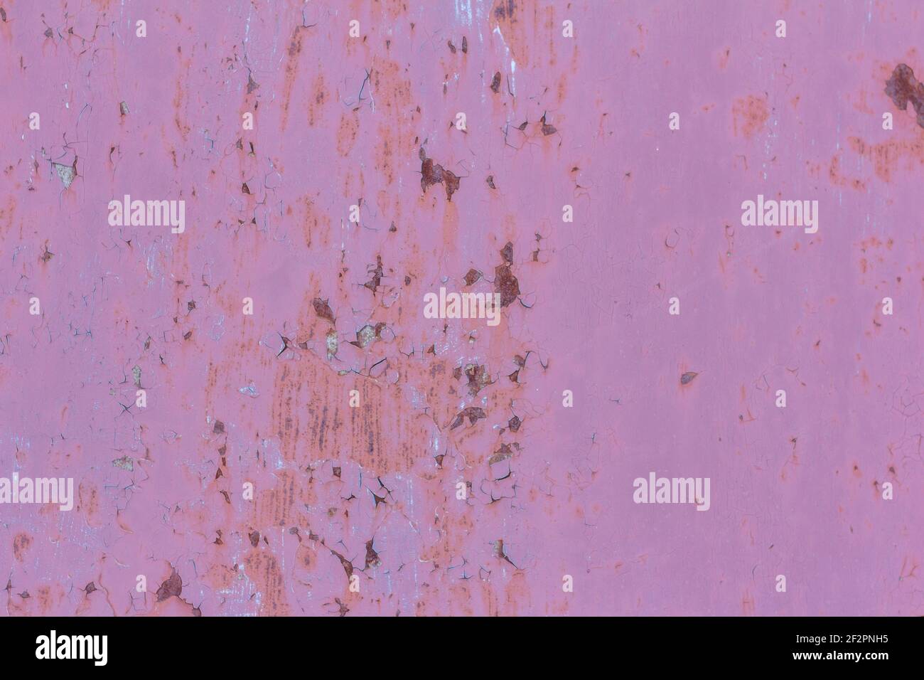 rusty metal pink wall with fallen off paint, rusty background Stock Photo