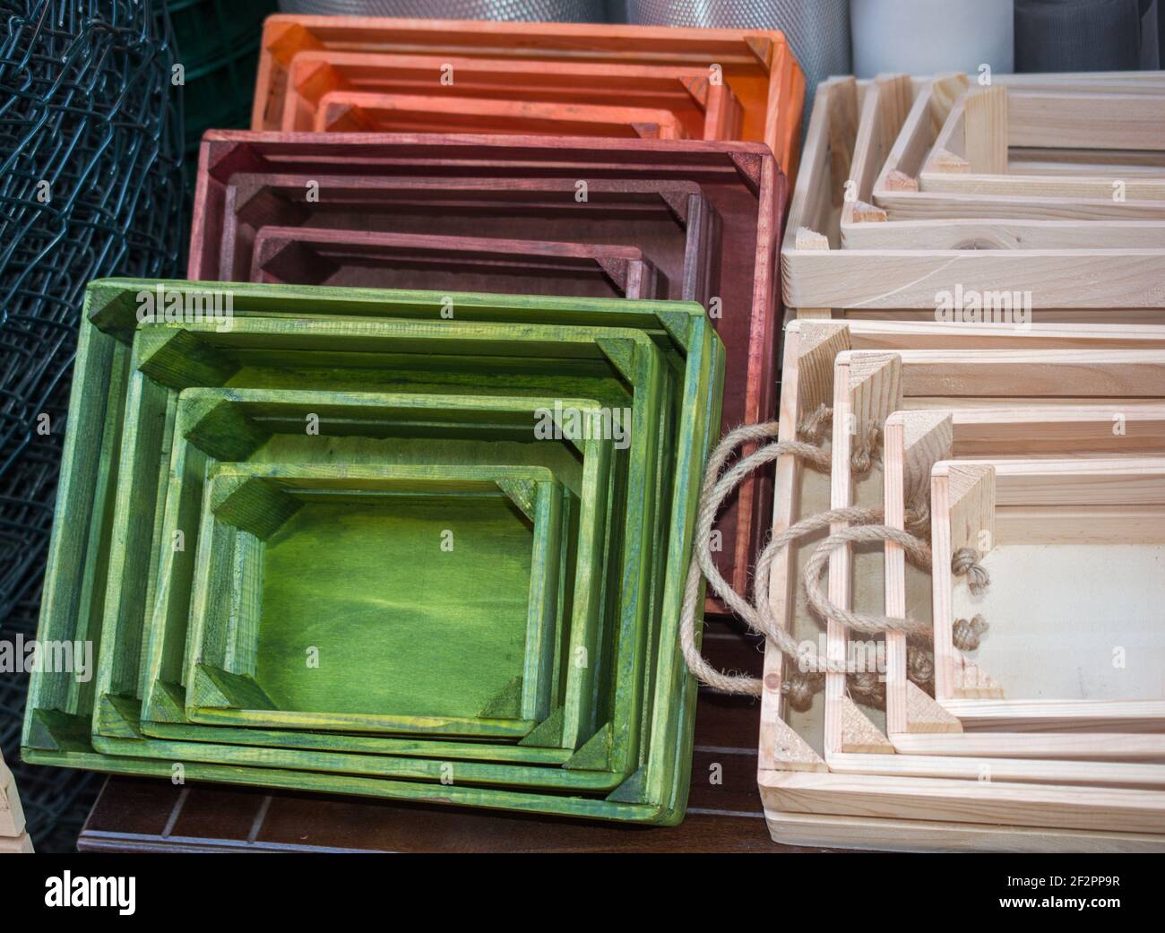 Colorful wooden crate boxes for sale in a market Stock Photo - Alamy