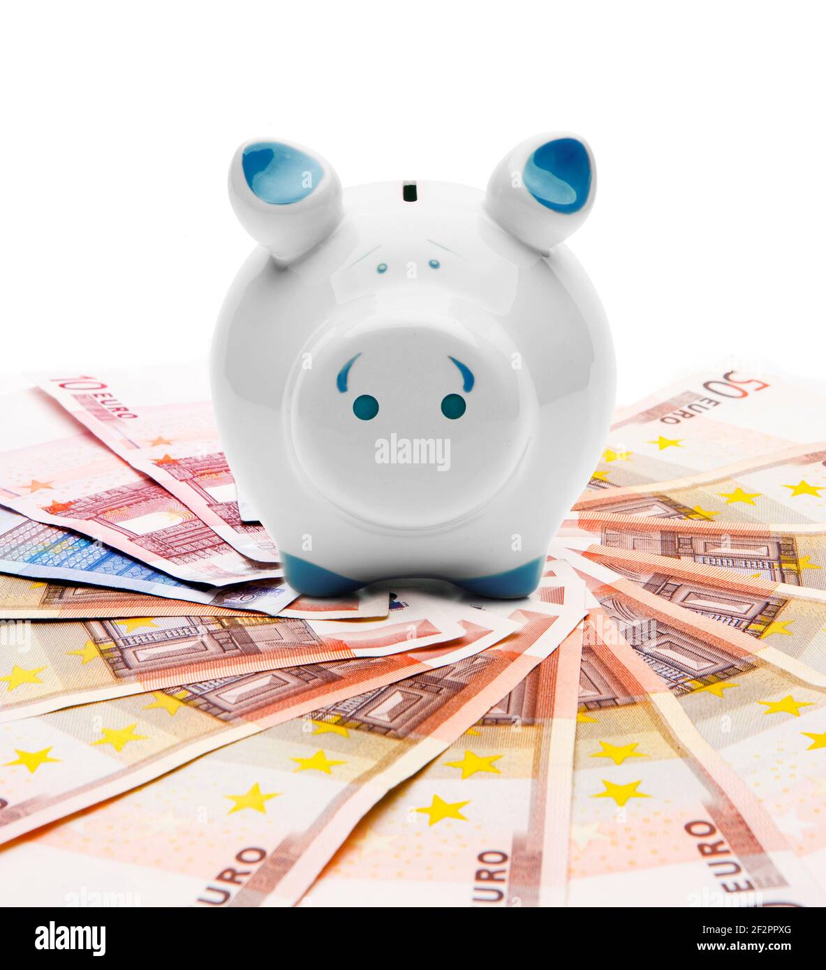 Piggy bank on banknotes in euro currency Stock Photo