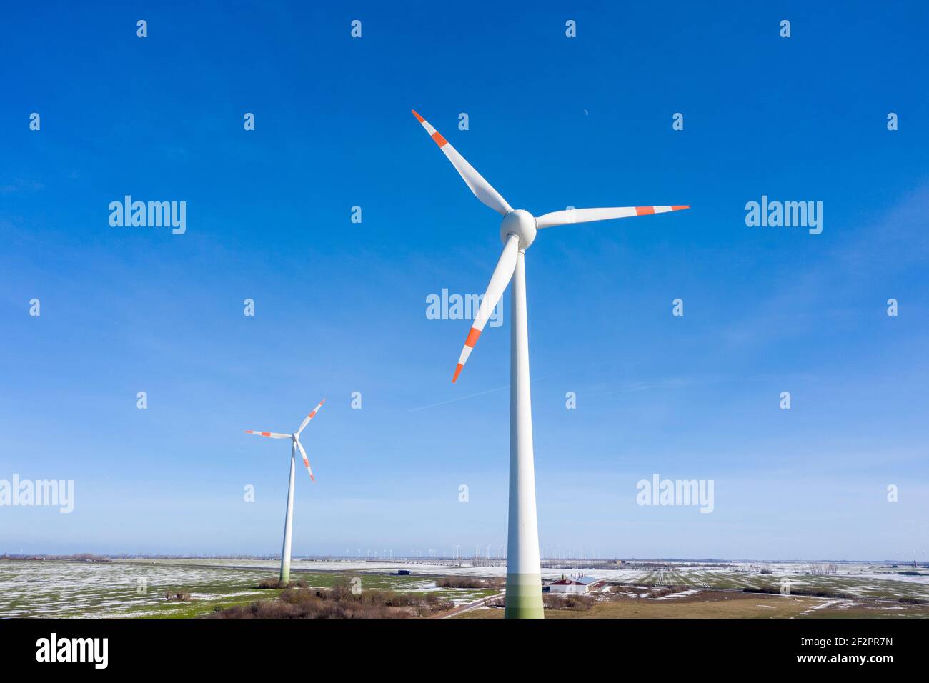 Germany, Saxony-Anhalt, Egeln, wind turbines in front of a blue sky Stock Photo