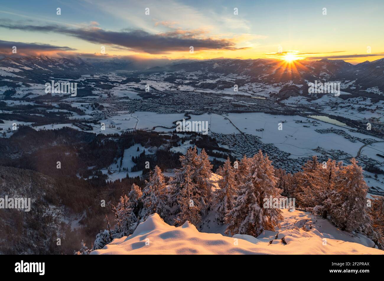Snowy winter landscape at sunset. View of the Illertal with Sonthofen. Allgau Alps, Bavaria, Germany Stock Photo