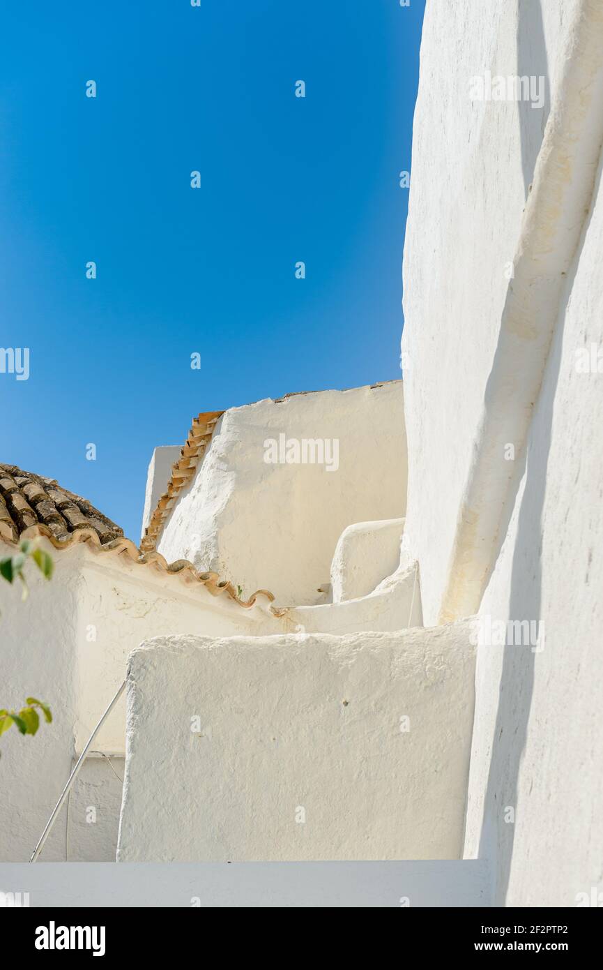 Monument 'Puig de Missa'. Architectural detail. The typical construction of the island of Ibiza in white lime. Detail of the construction in a church. Stock Photo