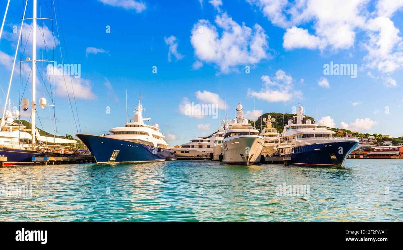 Gigantic yachts moored on the Dutch side of the island of Saint Martin in the Caribbean Stock Photo
