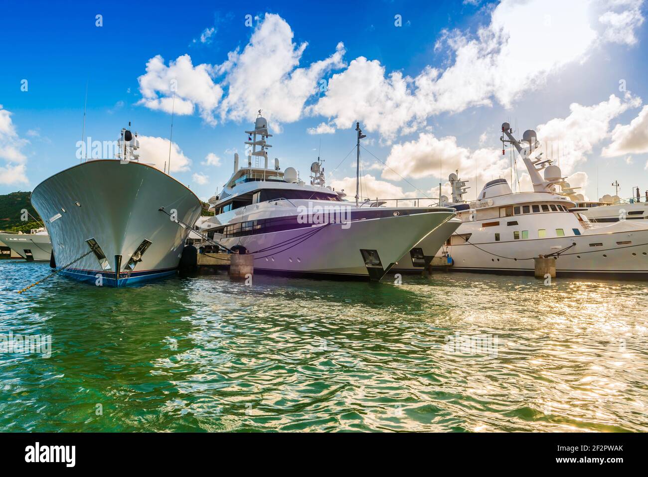 Gigantic yachts moored on the Dutch side of the island of Saint Martin in the Caribbean Stock Photo