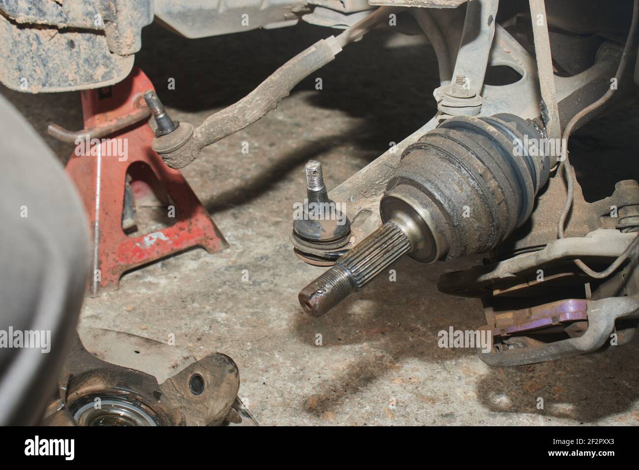Lower Arm Ball Joint and Outer CV Joint and Brake Caliper and