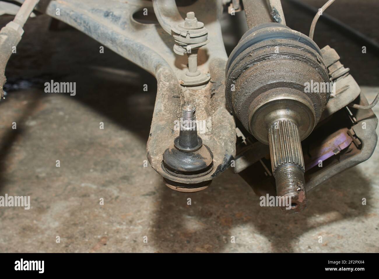 Lower Arm Ball Joint and Outer CV Joint and Brake Caliper and
