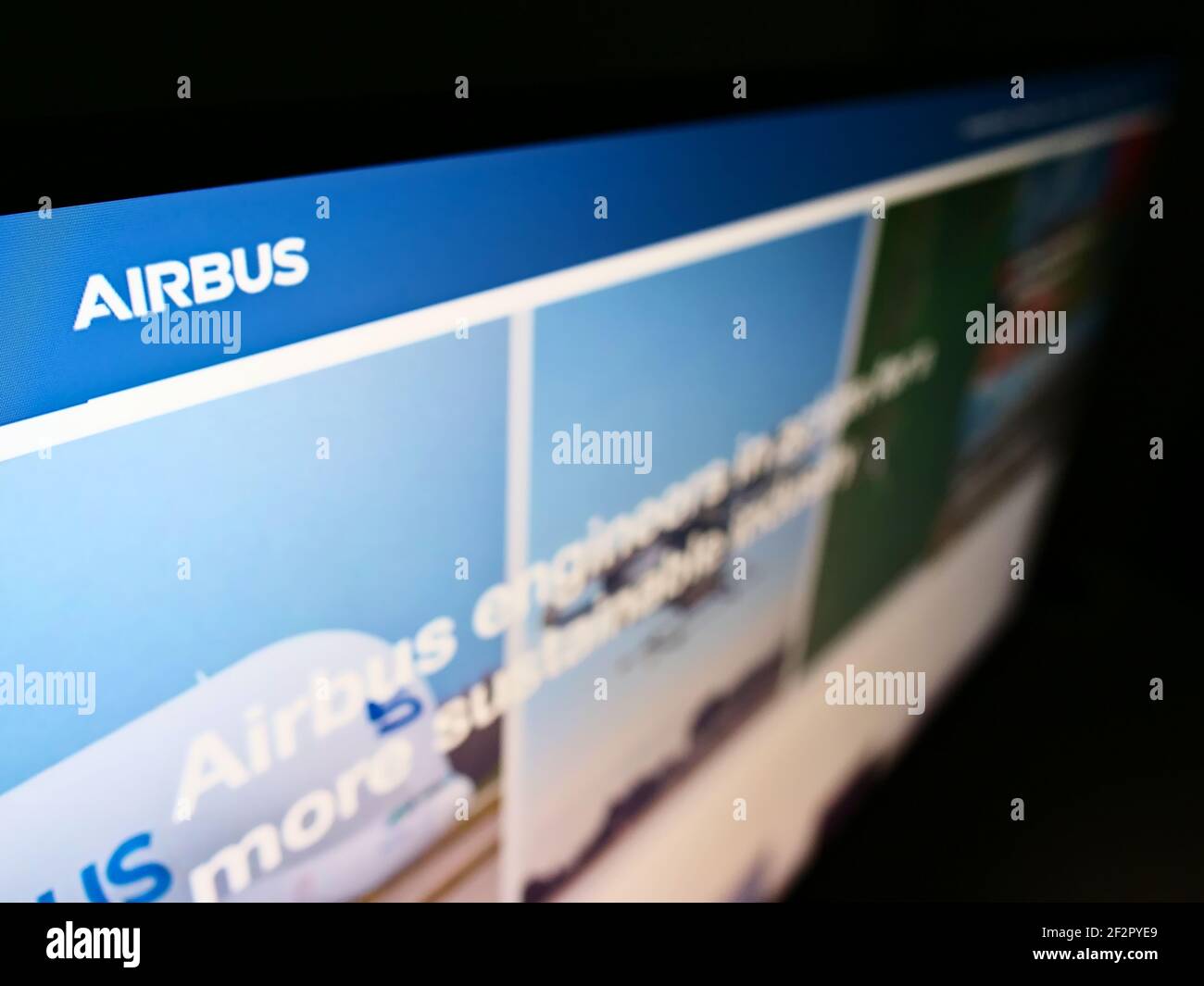 igh angle view of business website with company logo of airliner manufacturer Airbus SE on monitor. Focus on top-left of screen. Unmodified photo. Stock Photo