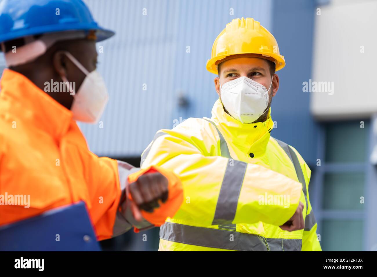 Construction Industry People Teamwork Elbow Bump Greeting Stock Photo