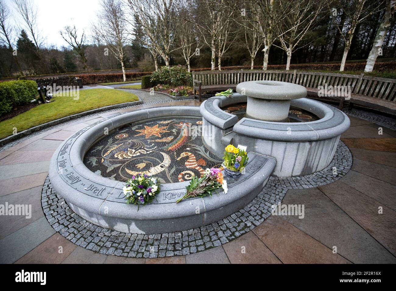 Floral tributes left at the memorial fountain at Dunblane Cemetery for