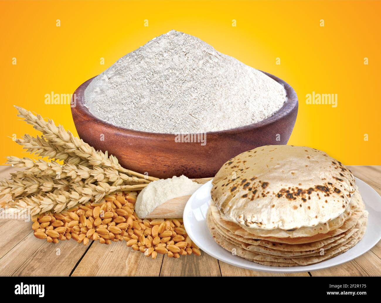 Wheat flour Bunch of wheat ears, dried grains in wooden bowl, flour in