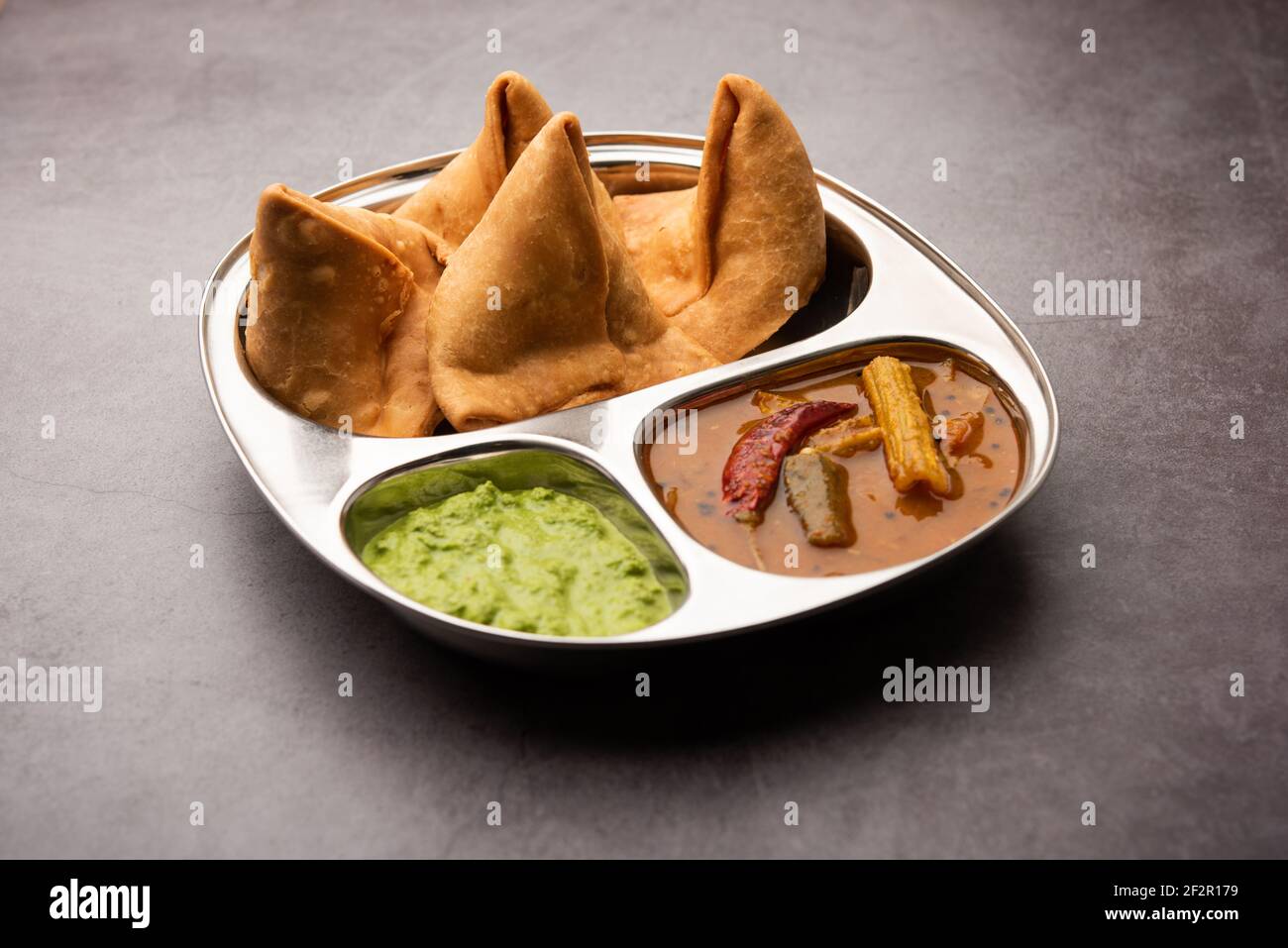 South indian Sambar Samosa Chutney it's a fusion food in which sambhar is from South and Samosas