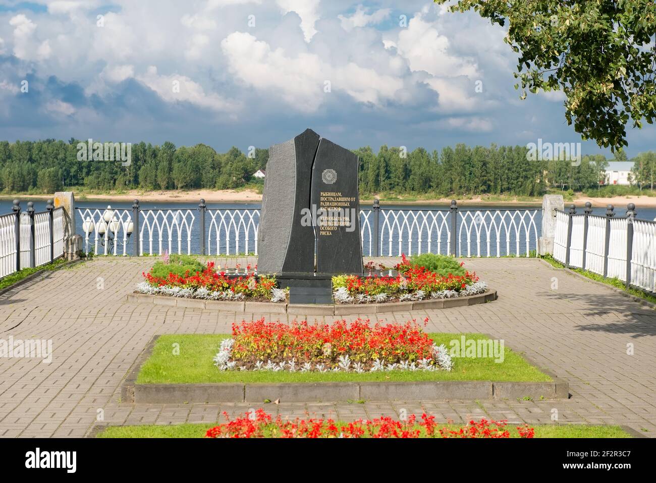 RYBINSK, RUSSIA / AUGUST 15,2020: Monument to victims of radiation catastrophes on the background of the cloudy sky on a summer day, Nikolsky Boulevar Stock Photo