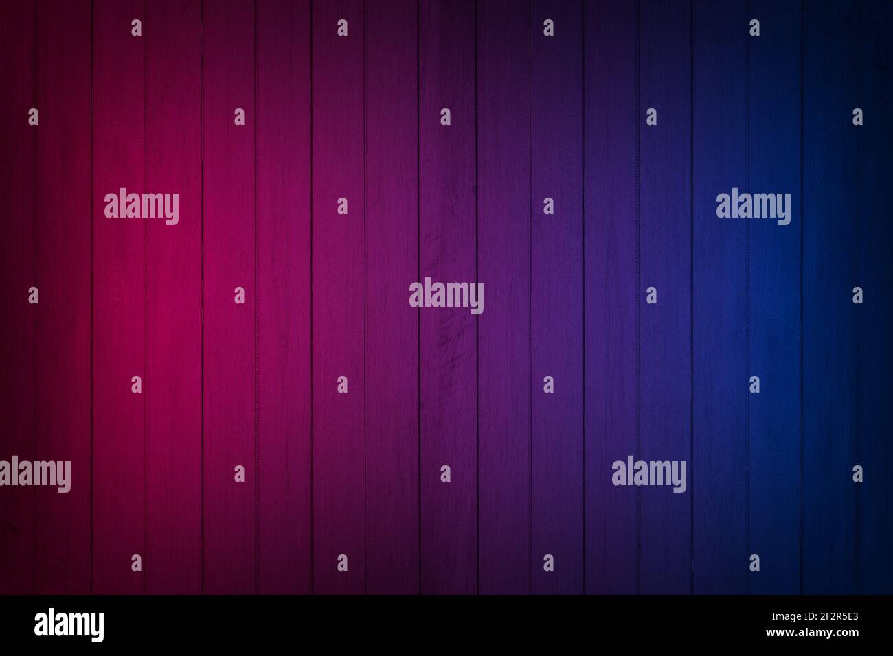 Neon light on wood wall texture background. Lighting effect red and blue neon backgrounds. Stock Photo