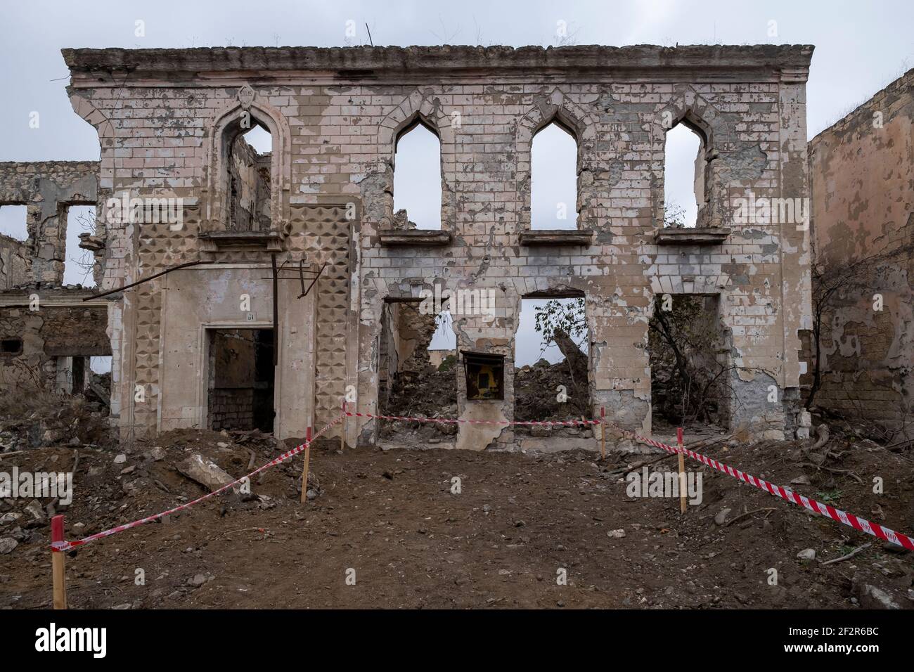 AGDAM, AZERBAIJAN - DECEMBER 14: Ruins of the culture center in the town of Agdam which was destroyed by Armenian forces during the First Nagorno-Karabakh War on December 14, 2020 in Agdam, Azerbaijan. The town and its surrounding district were returned to Azerbaijani control as part of an agreement that ended the 2020 Nagorno-Karabakh War. Stock Photo