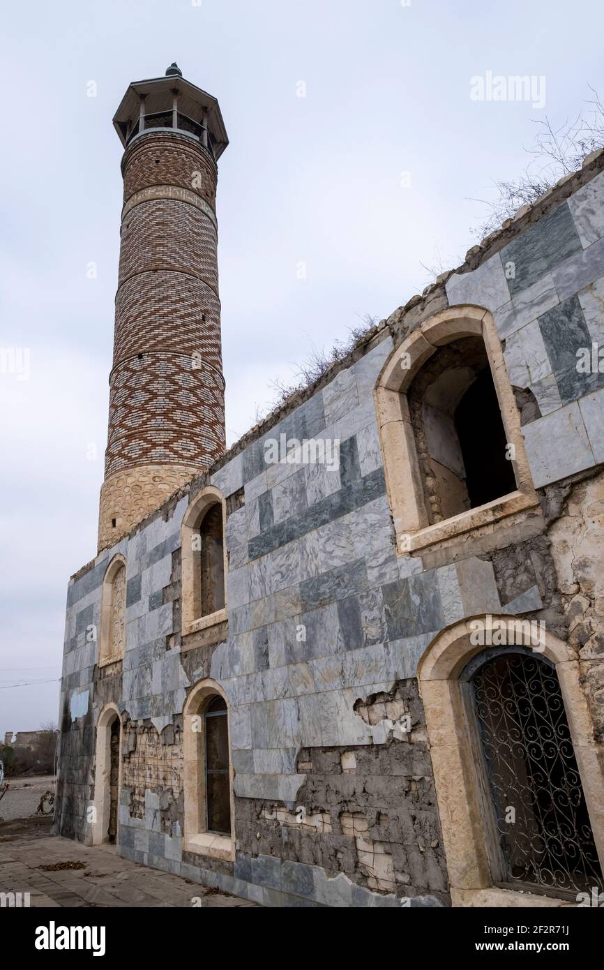 AGDAM, AZERBAIJAN - DECEMBER 14: Exterior of the19th century Juma Mosque the only building left standing in the town of Agdam which was destroyed by Armenian forces during the First Nagorno-Karabakh War on December 14, 2020 in Agdam, Azerbaijan. The town and its surrounding district were returned to Azerbaijani control as part of an agreement that ended the 2020 Nagorno-Karabakh War. Stock Photo