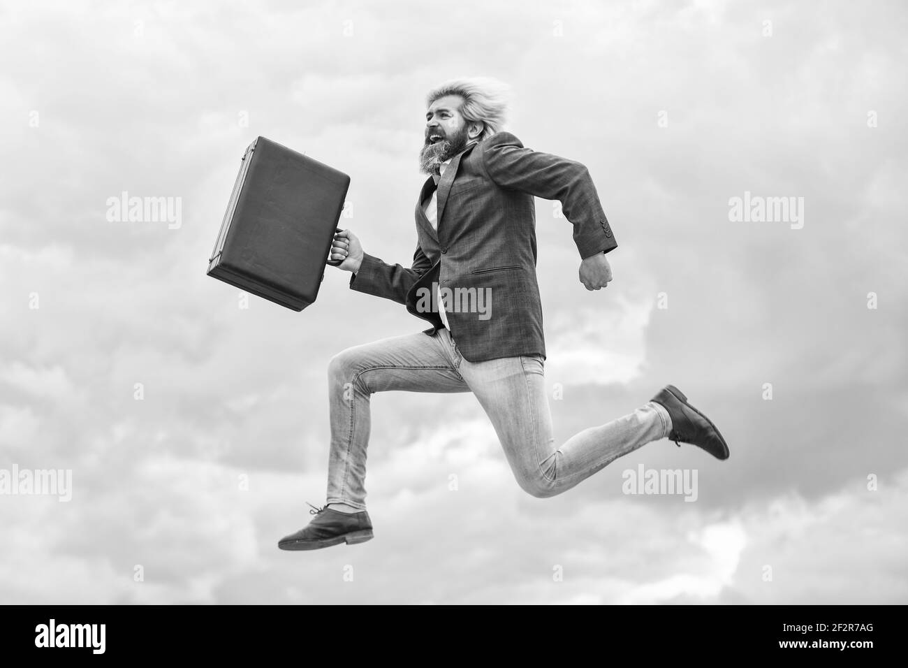 Business success. successful male boss. rush hour. deadline. businessman hurry up with case. brutal mature man in jacket carry briefcase. running to Stock Photo