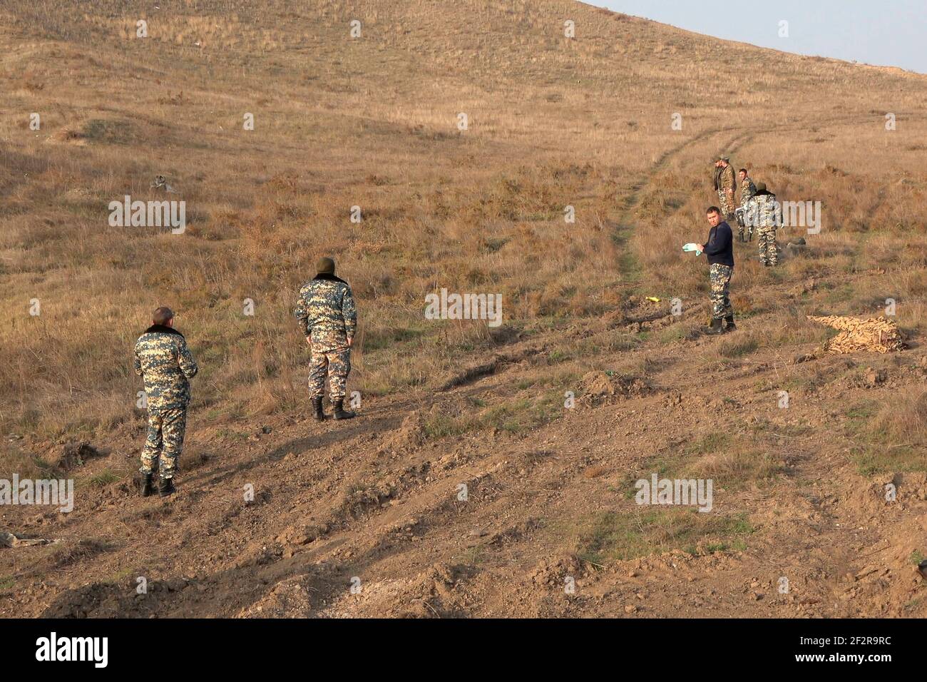JABRAYIL, AZERBAIJAN - DECEMBER 15: Members of the Russian peacekeeping troops force and Armenian servicemen looking for remains of Armenian fighters killed in the conflict over the disputed region of Nagorno-Karabakh on December 15 2020 in the Jabrayil Rayon of Azerbaijan. Heavy clashes erupted over Nagorno-Karabakh in late September during which more than 5,600 people, including civilians, were killed. The sides agreed to a Russia-brokered cease-fire deal that took effect on November 10, resulting in Azerbaijan regaining control over swaths of territory ethnic Armenians had administered for Stock Photo