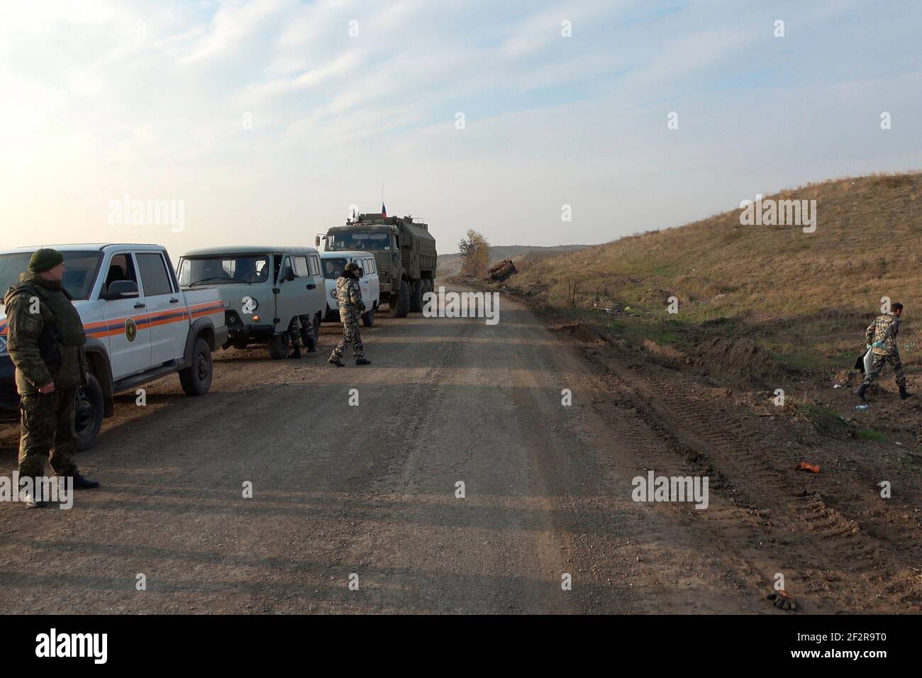 JABRAYIL, AZERBAIJAN - DECEMBER 15: Russian peacekeepers escort a convoy that includes Nagorno-Karabakh emergency personnel and Red Cross officials which mission is to search for remains of Armenian fighters killed in the conflict over the disputed region of Nagorno-Karabakh and transfer them to Armenia on December 15 2020 in the Jabrayil Rayon of Azerbaijan. Heavy clashes erupted over Nagorno-Karabakh in late September during which more than 5,600 people, including civilians, were killed. The sides agreed to a Russia-brokered cease-fire deal that took effect on November 10, resulting in Azerb Stock Photo