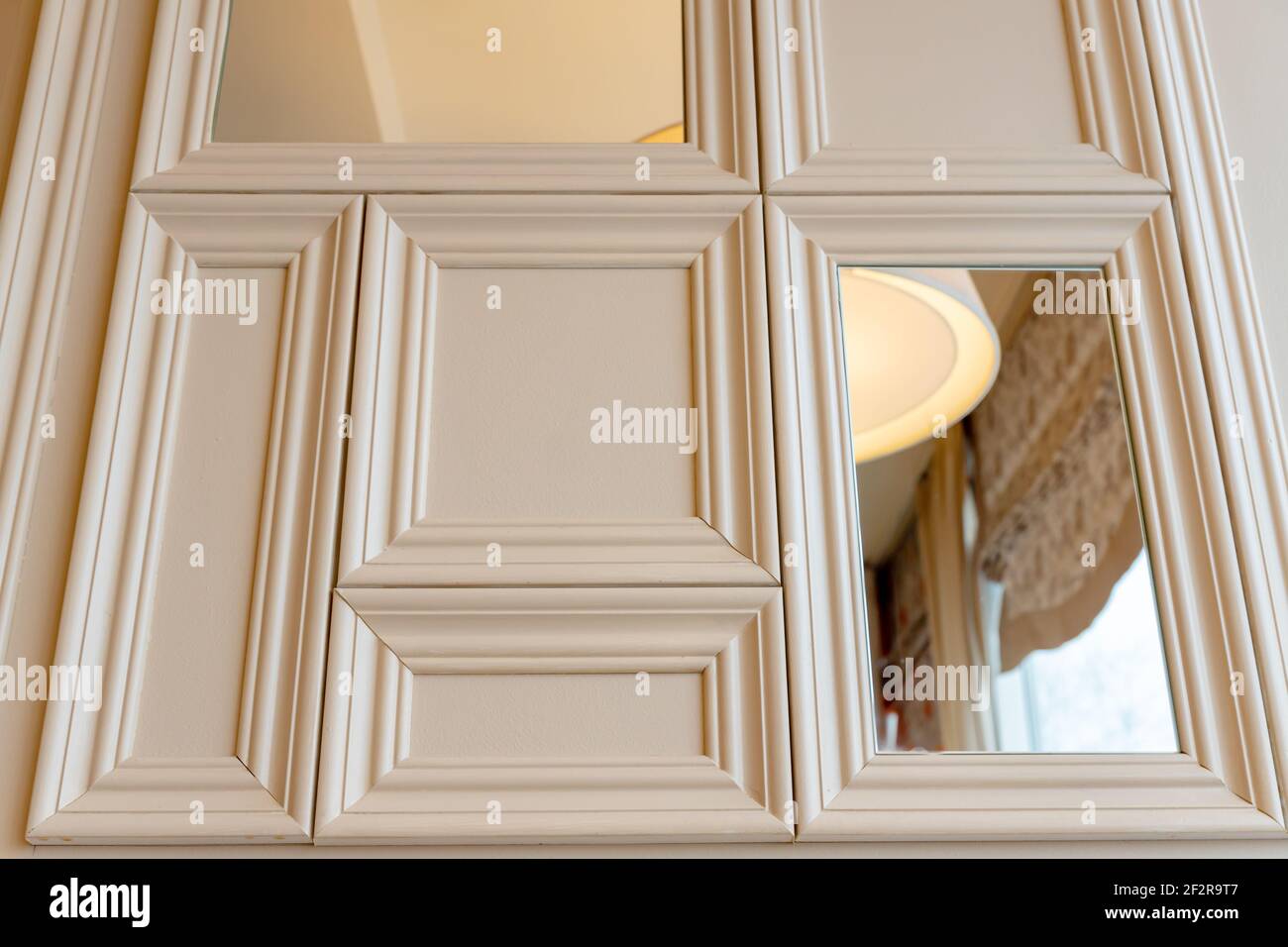 Classical interior of a living room with molding frames and mirrors