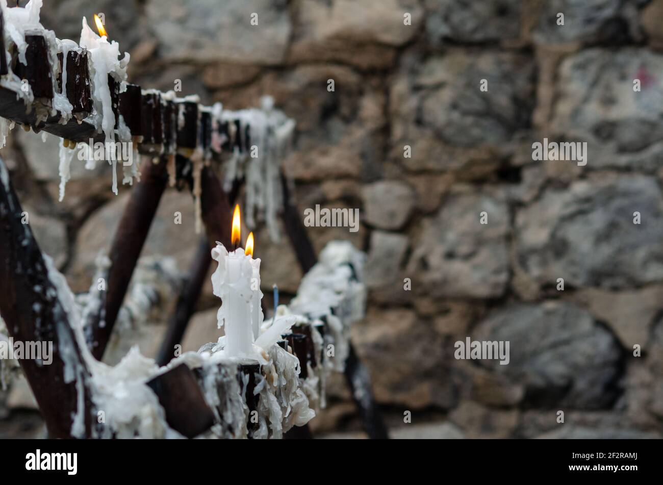 burning candle, burning flame, prayers, rocky bottom, candle wax Stock