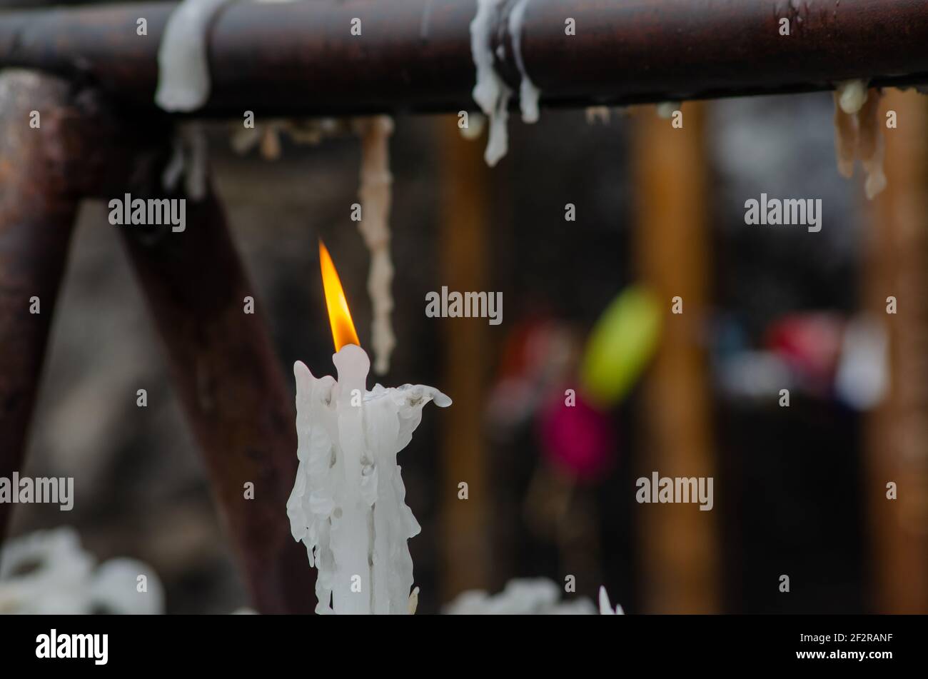 burning candle, burning flame, prayers, rocky bottom, candle wax Stock