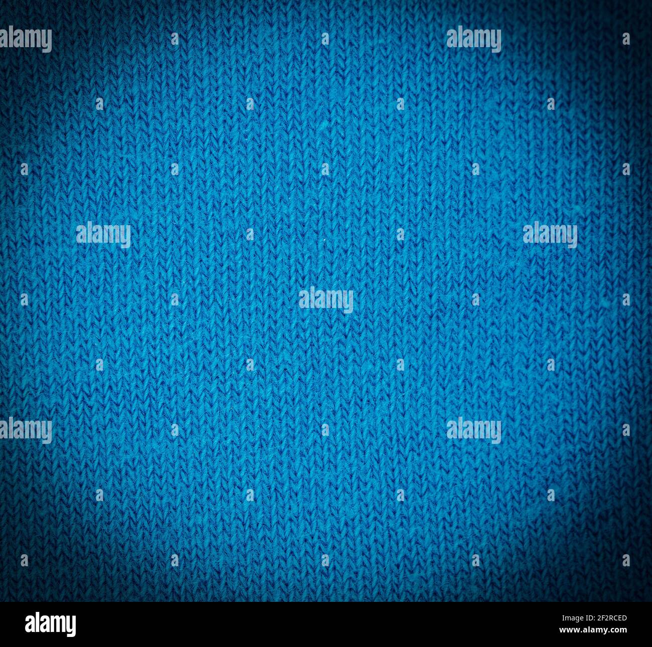The Blue knitted fabric texture as abstract background Stock Photo - Alamy