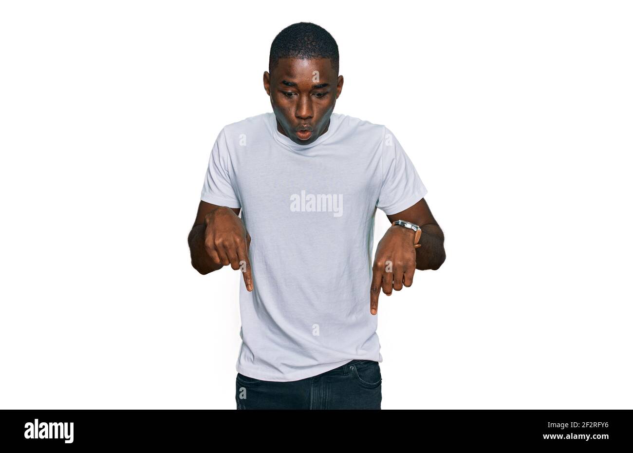 Young african american man wearing casual white t shirt pointing down ...