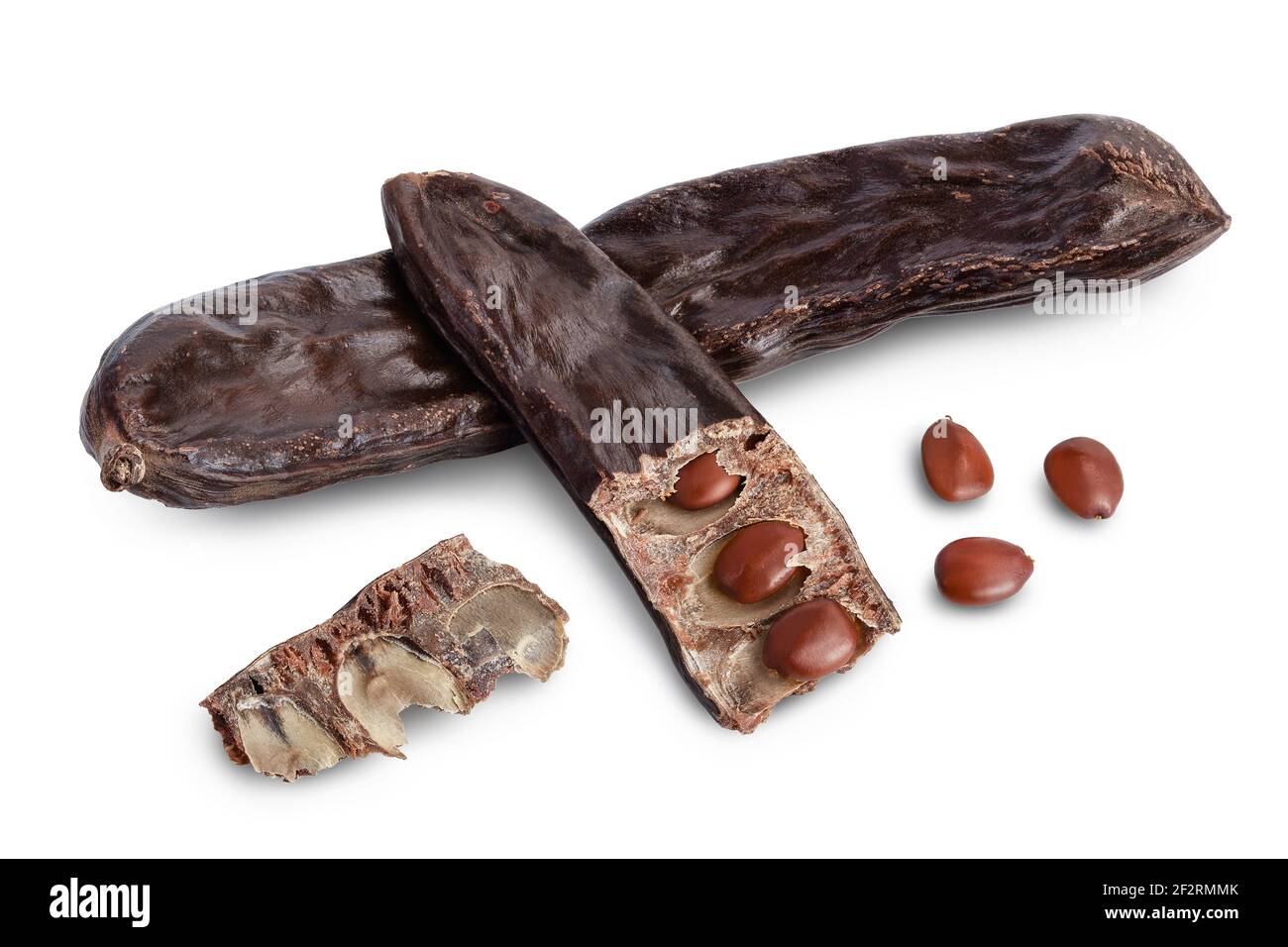 Ripe carob pods and bean isolated on white background with clipping