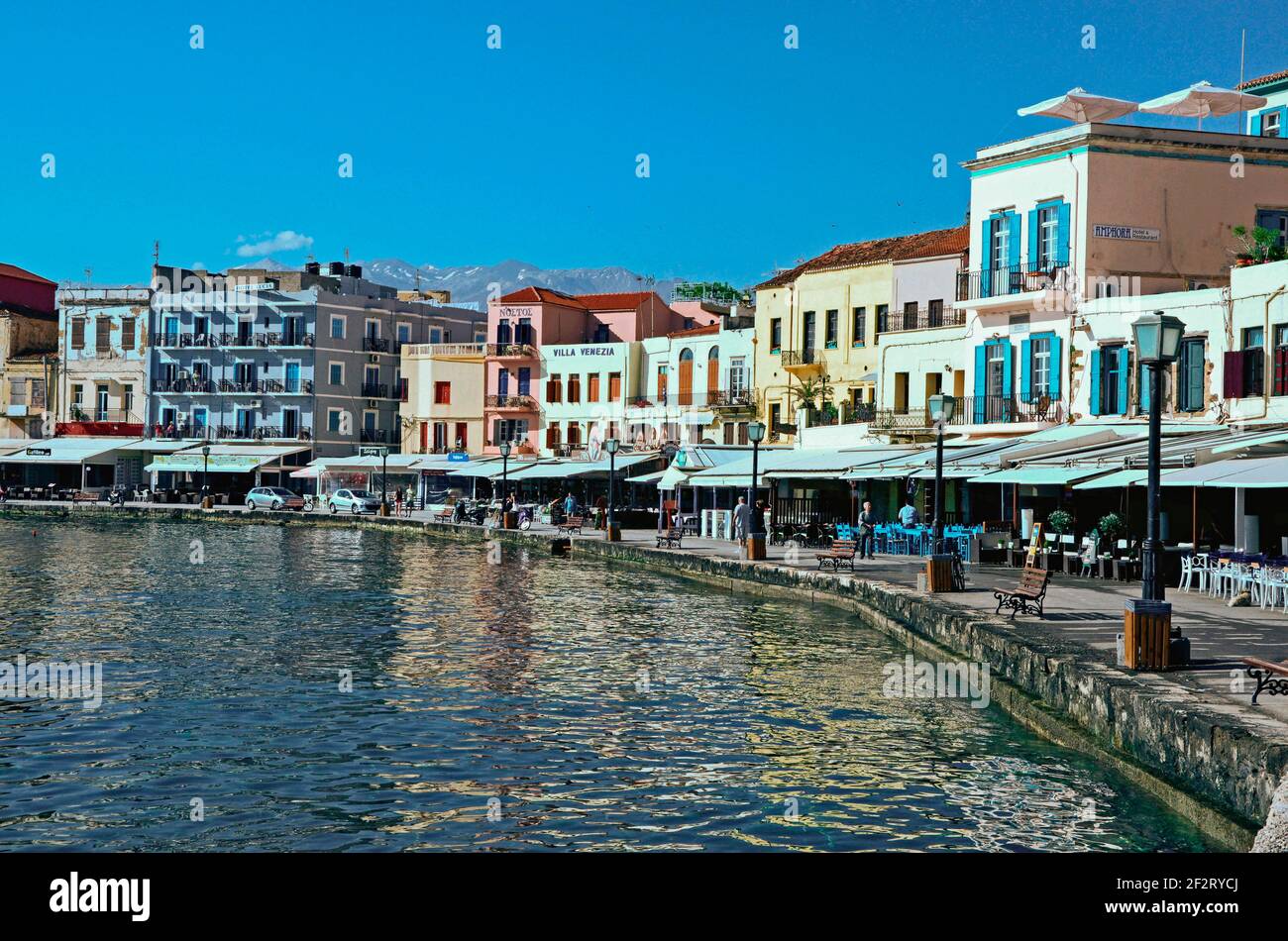 THE OLD VENETIAN HARBOUR. CHANIA, CRETE. GREEK ISLANDS. MAY. The old 16th centurry Harbour at Chania on the Greek Island of Crete is a real holiday de Stock Photo
