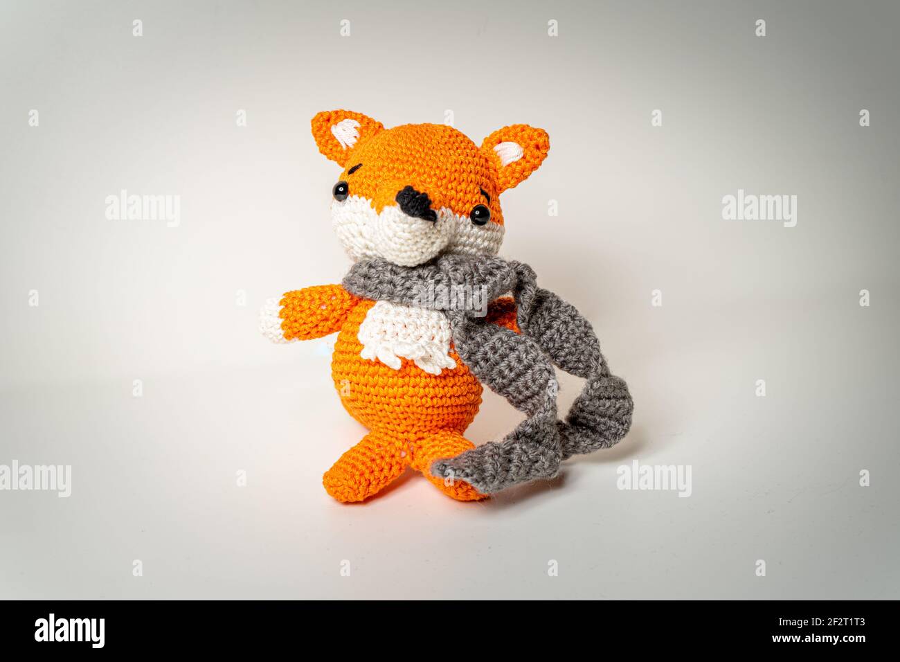 Amigurumi Orange Fox with Scarf out of Wool Bavaria Stock Photo