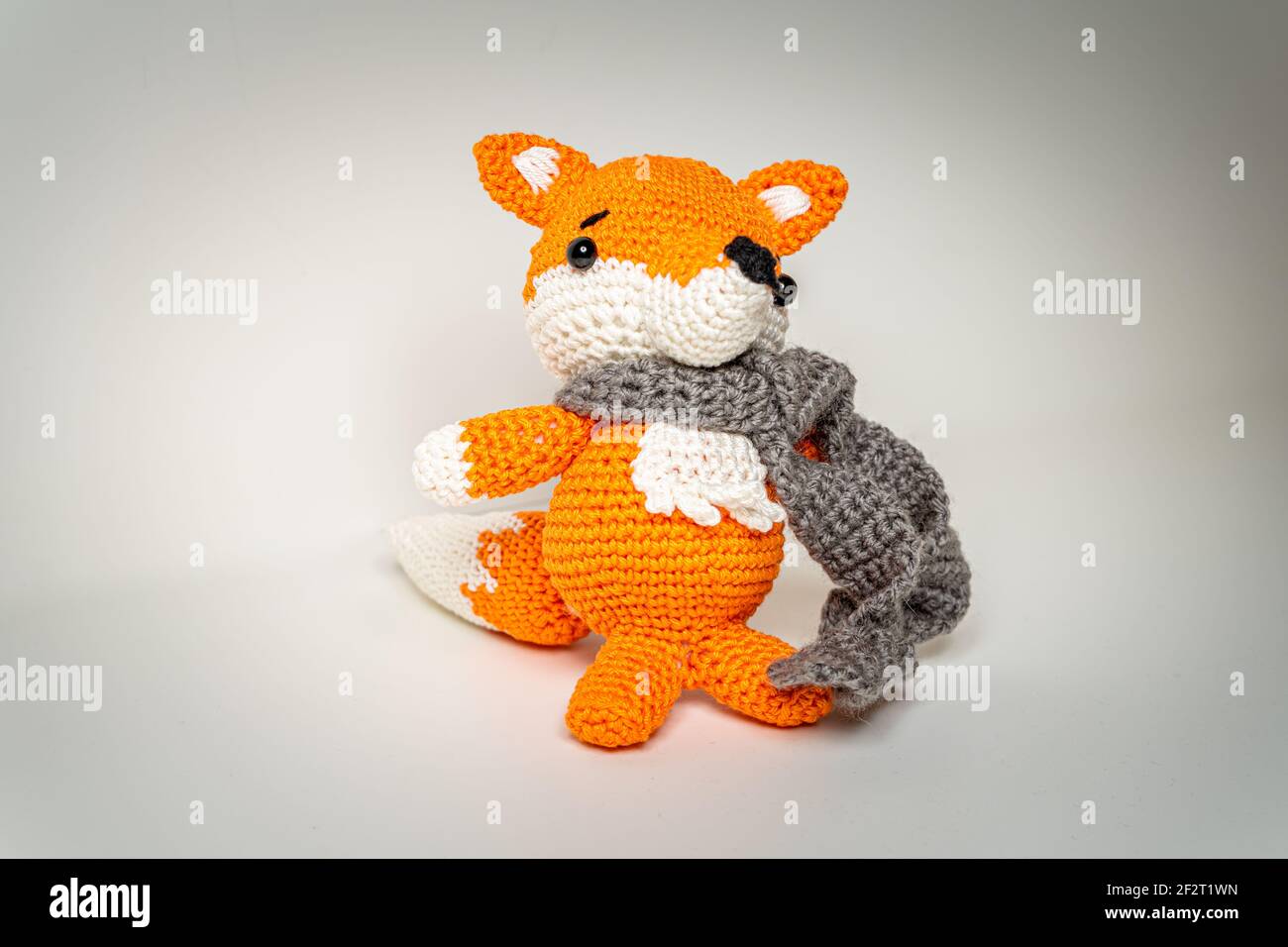 Amigurumi Orange Fox with Scarf out of Wool Bavaria Stock Photo