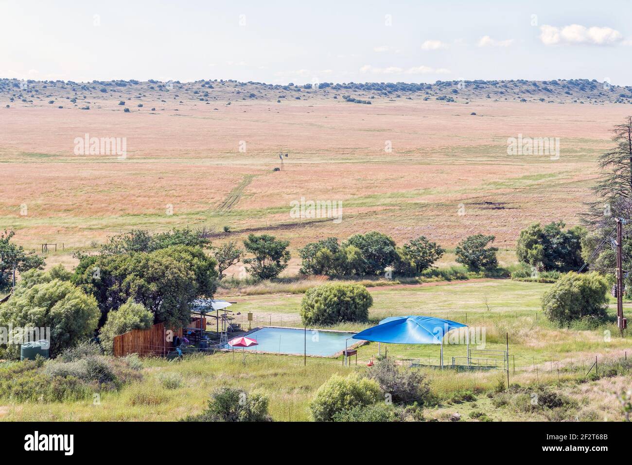 BLOEMFONTEIN, SOUTH AFRICA - FEBRUARY 27, 2021: View of Farm Windhoek, a working farm which offers a caravan park and chalets, near Bloemfontein. A sw Stock Photo