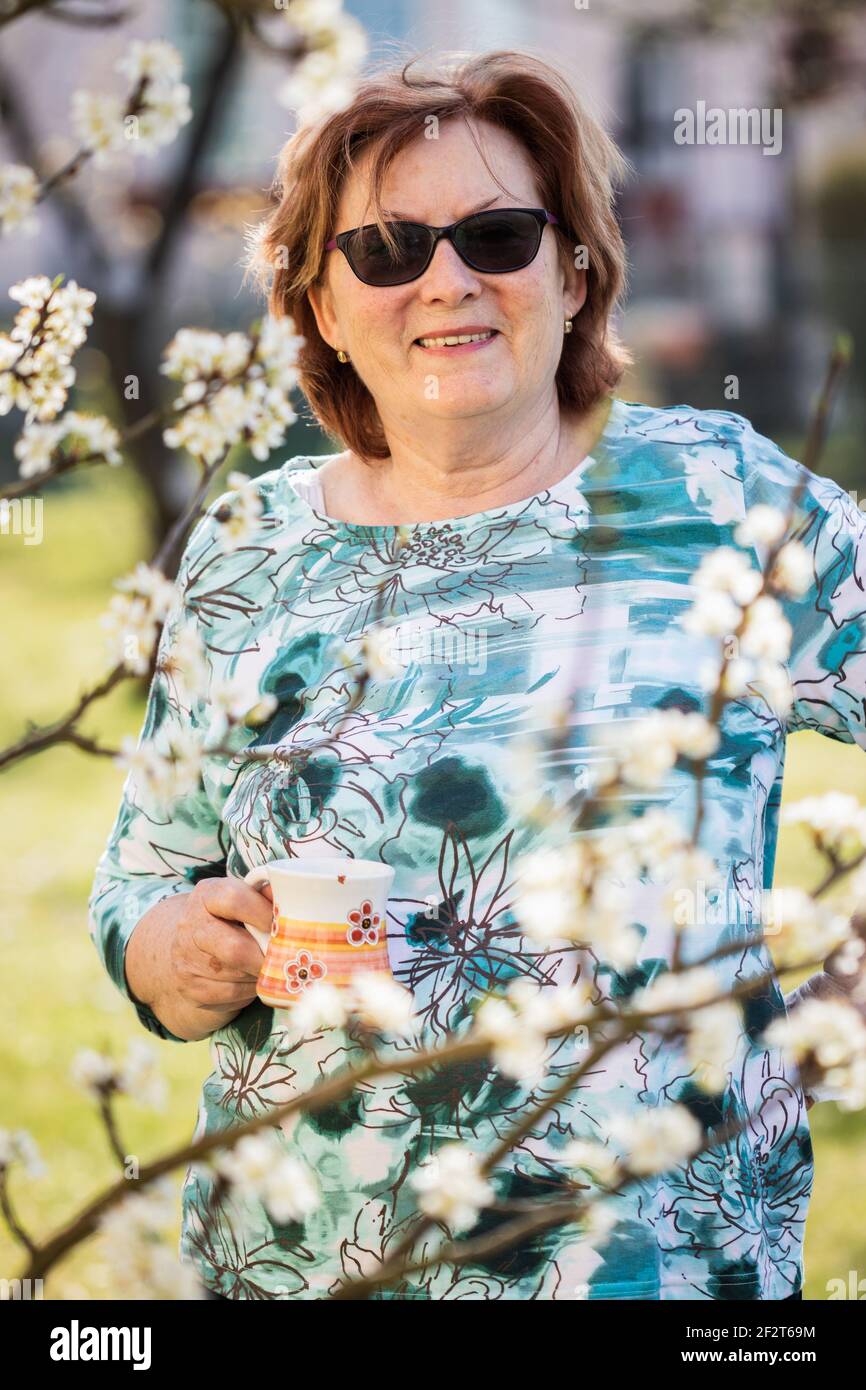 Smiling senior woman spring hi-res stock photography and images - Alamy