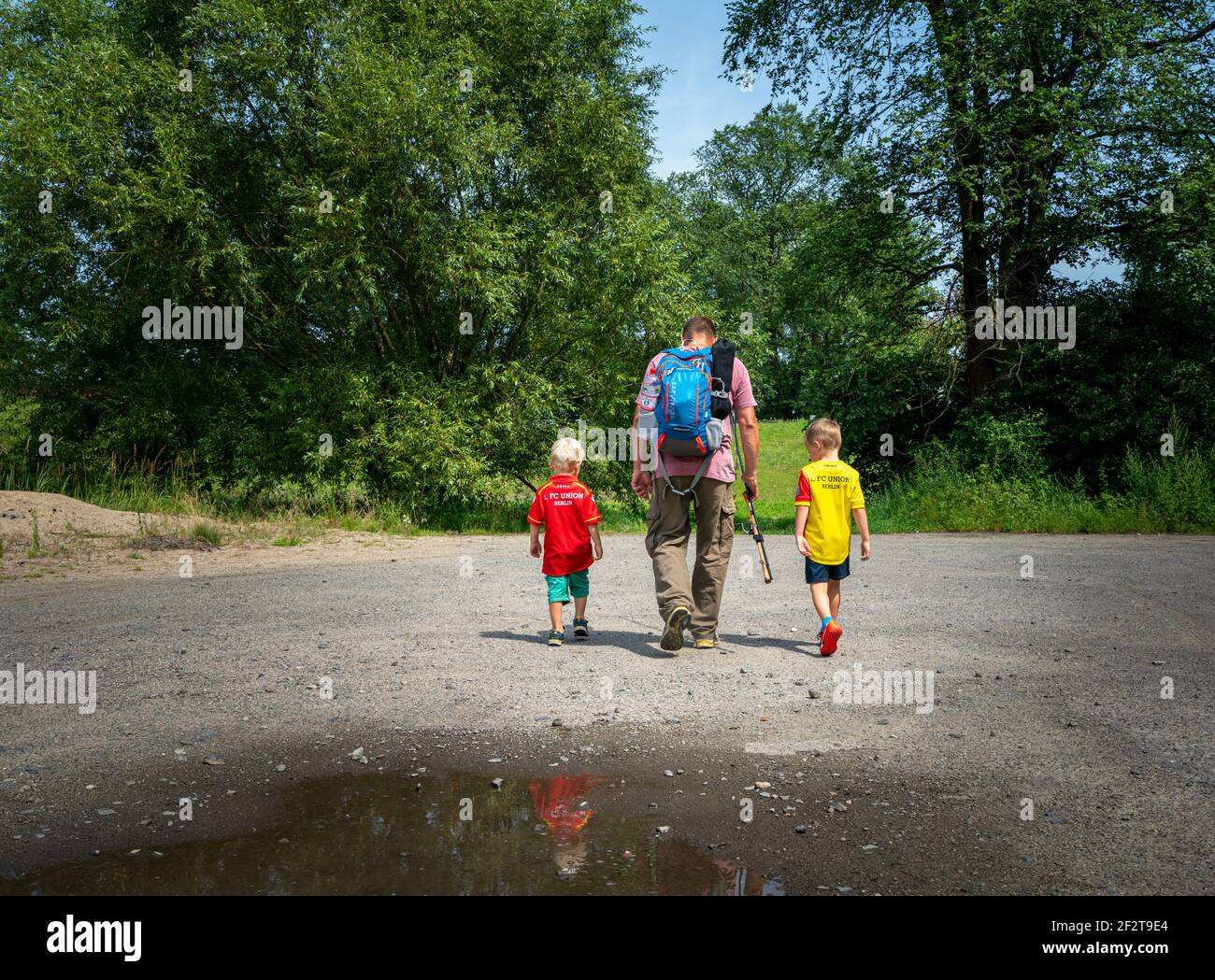 father goes fishing with his two sons at or in brandenburg, germany Stock Photo