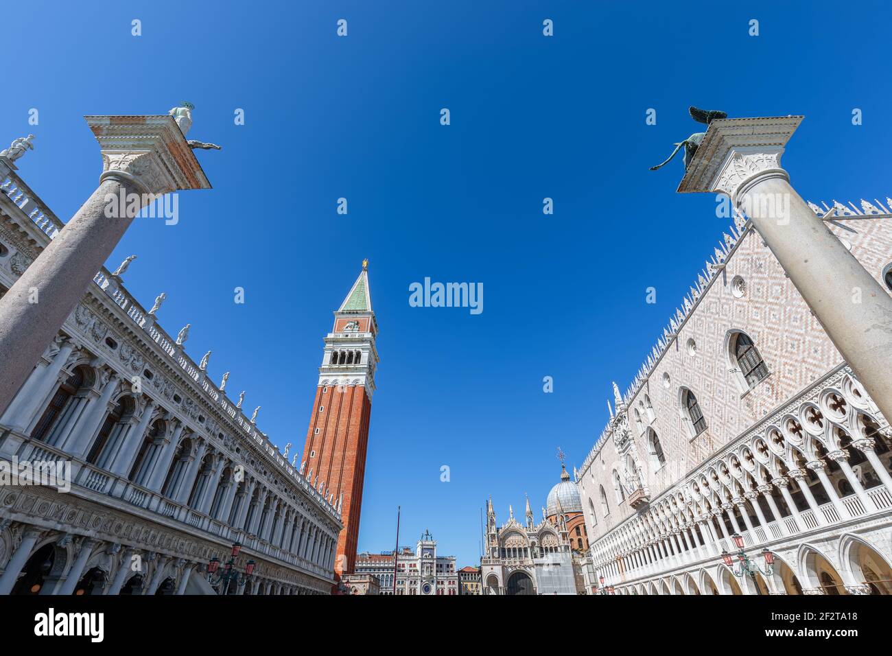 Worlds most beautiful square San Marco (Piazza San Marco). View of the famous columns, Doge's Palace (Palazzo Ducale), and St. Mark's Bell Tower (Camp Stock Photo