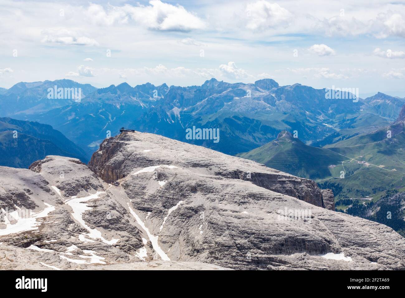 Mountain view and the trail with climbers walking along the path to the