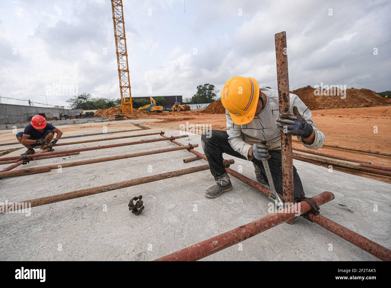 Wenchang, China's Hainan Province. 13th Mar, 2021. Workers work at the construction site of an aerospace supercomputing center project in Wenchang, south China's Hainan Province, March 13, 2021. The project is one of the key parts of the construction of the Hainan Free Trade Port. Credit: Pu Xiaoxu/Xinhua/Alamy Live News Stock Photo