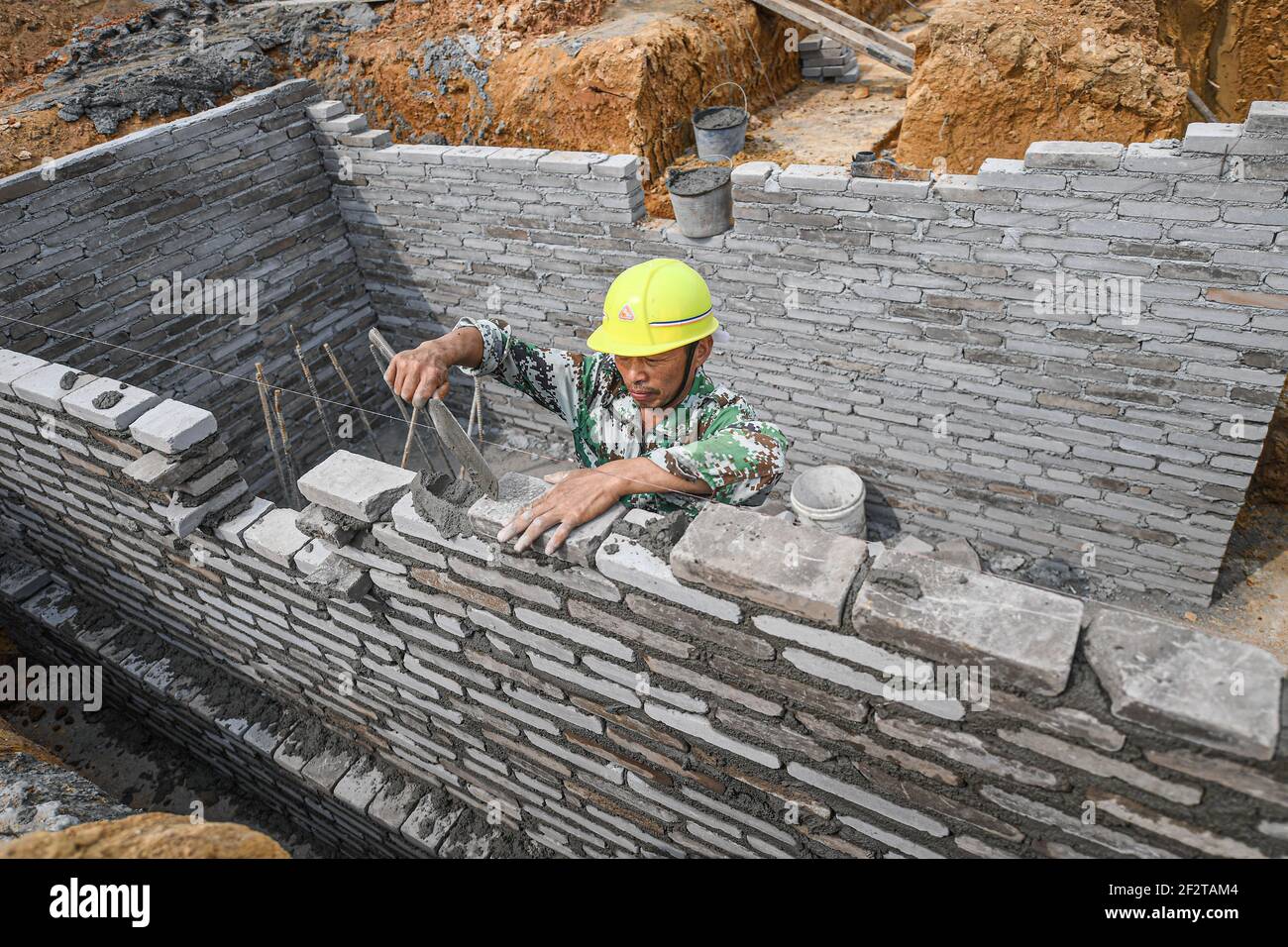 Wenchang, China's Hainan Province. 13th Mar, 2021. A worker works at the construction site of an aerospace supercomputing center project in Wenchang, south China's Hainan Province, March 13, 2021. The project is one of the key parts of the construction of the Hainan Free Trade Port. Credit: Pu Xiaoxu/Xinhua/Alamy Live News Stock Photo