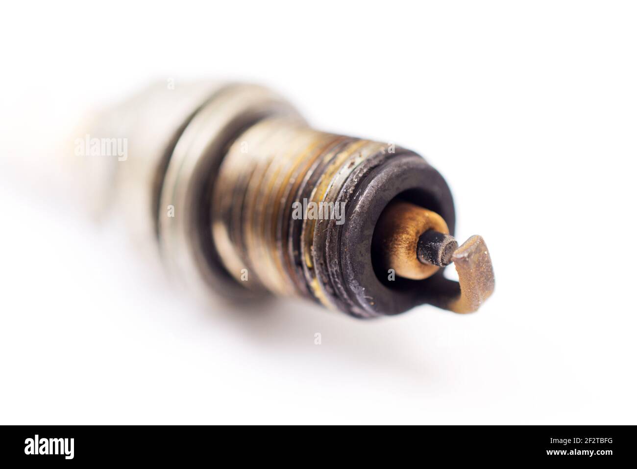 closeup shot of used spark plug on white background Stock Photo