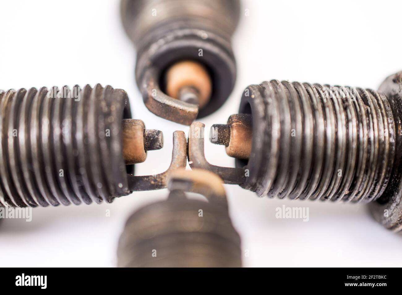 closeup shot of used spark plug on white background Stock Photo