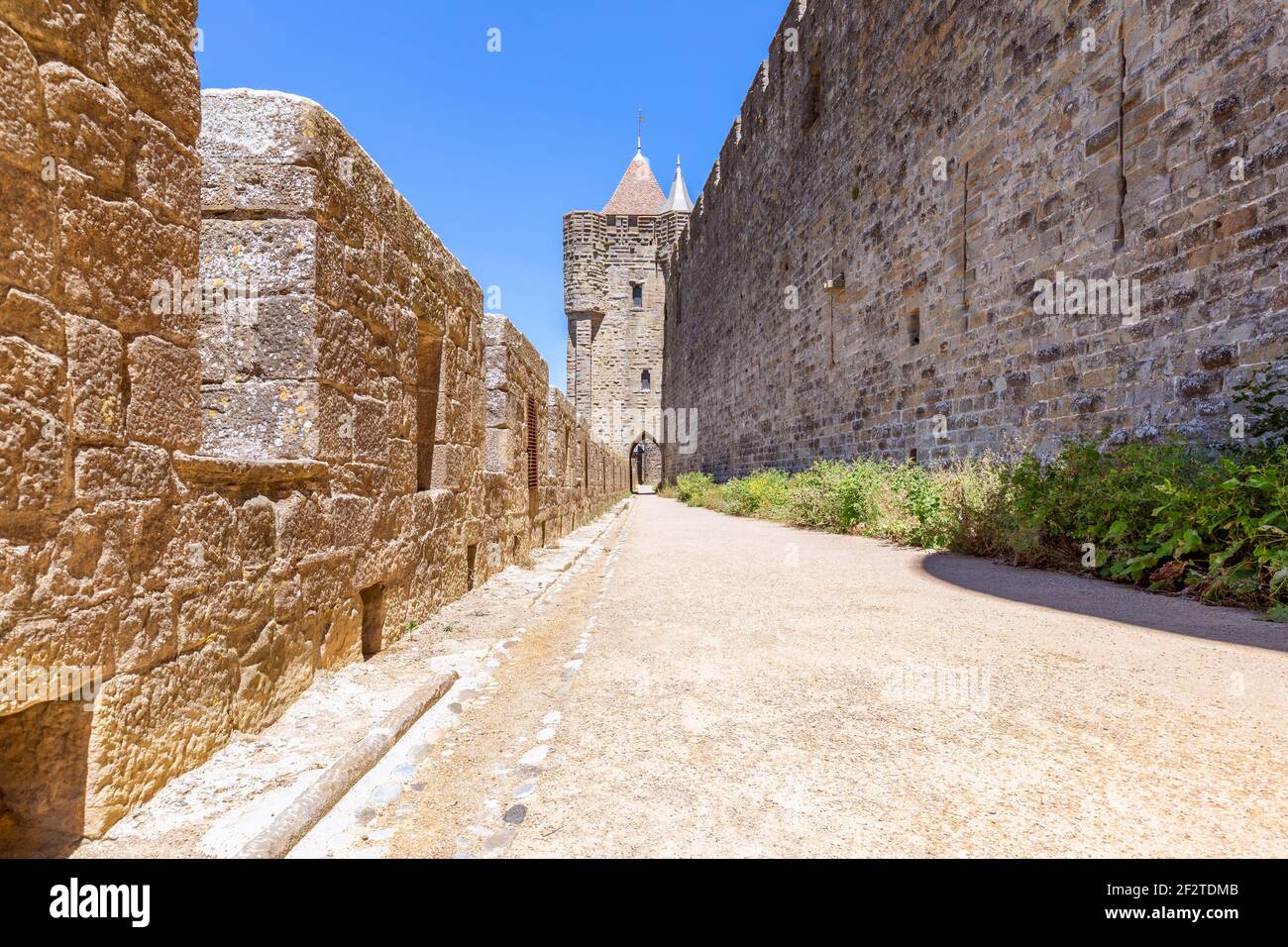 Wide fortified walls with walkways and arches of medieval castle of Carcassonne town Stock Photo