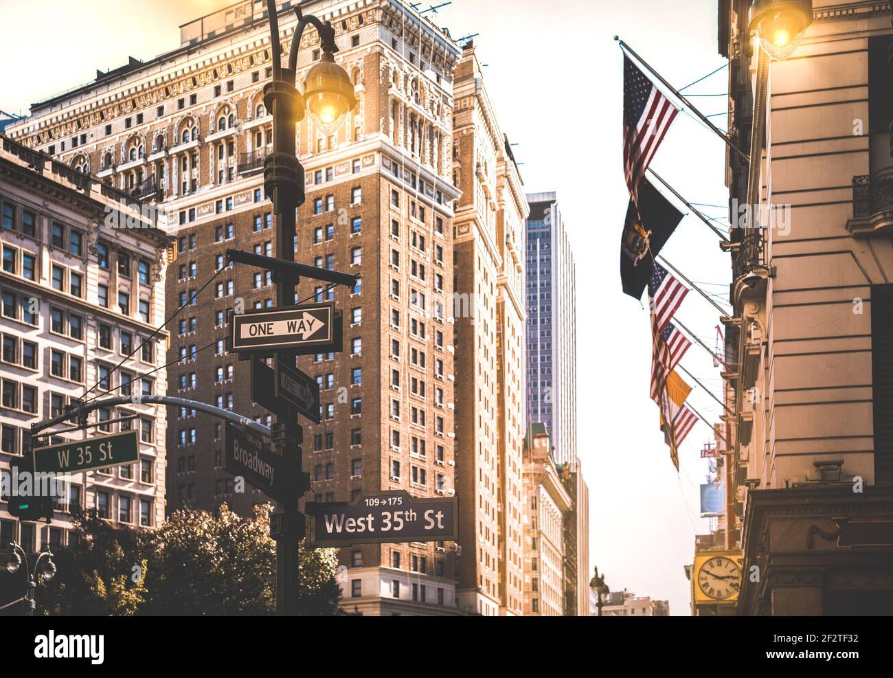 Street signs between Broadway and West 35th St at sunset in New York City - Urban concept and road direction in Manhattan downtown Stock Photo