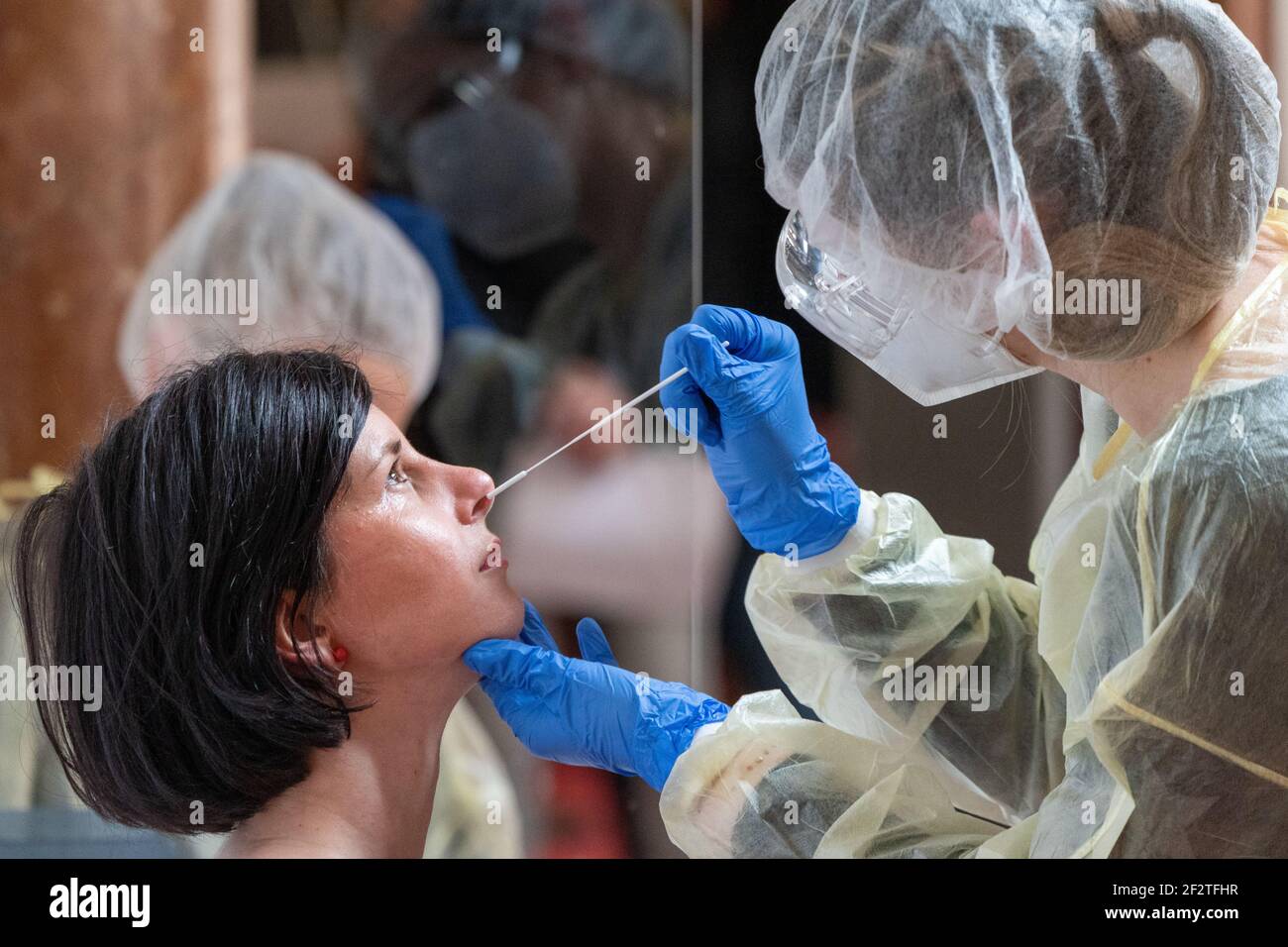Leipzig, Germany. 13th Mar, 2021. A Leipzig woman gets tested at the
