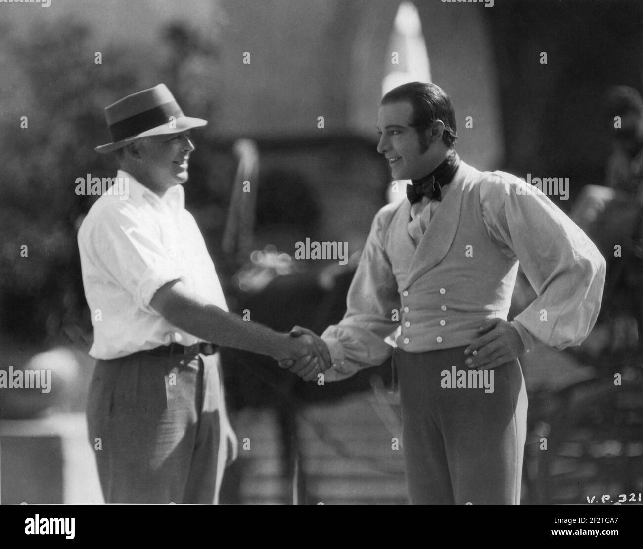 Director CLARENCE BROWN and RUDOLPH VALENTINO on set candid during ...