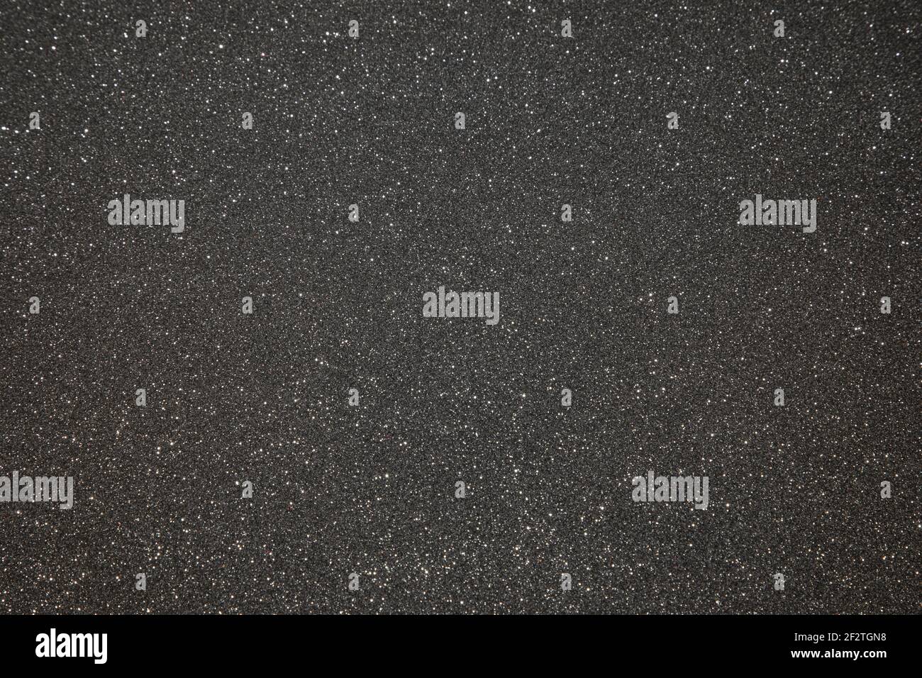 Black texture with micro-relief and glitter. Black glitter texture Stock Photo