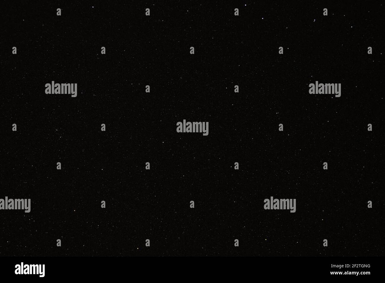 Black texture with micro-relief and glitter similar to the night sky with stars Stock Photo