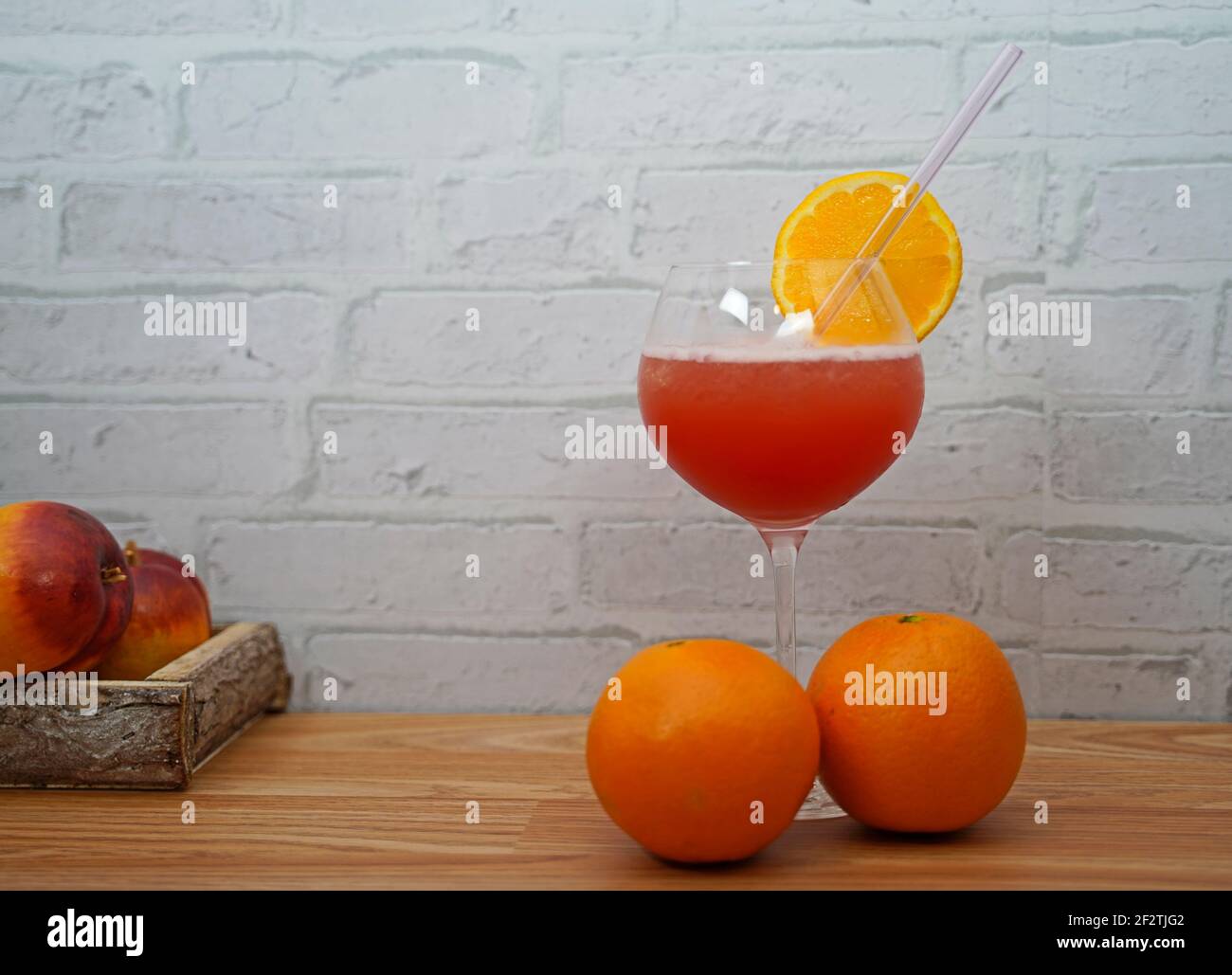 Red sun in the tropics. tasty and fruity cocktails served in glasses Stock Photo